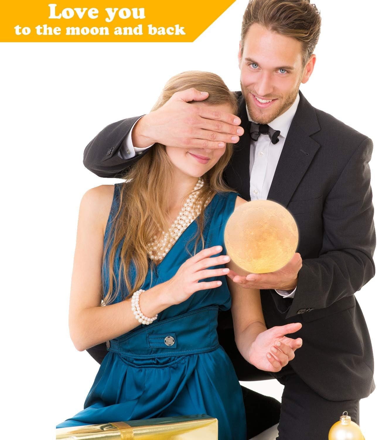 Couple with woman blindfolded holding a 16-color LED 3D printed moon lamp with remote and wooden stand for room decor and gifts