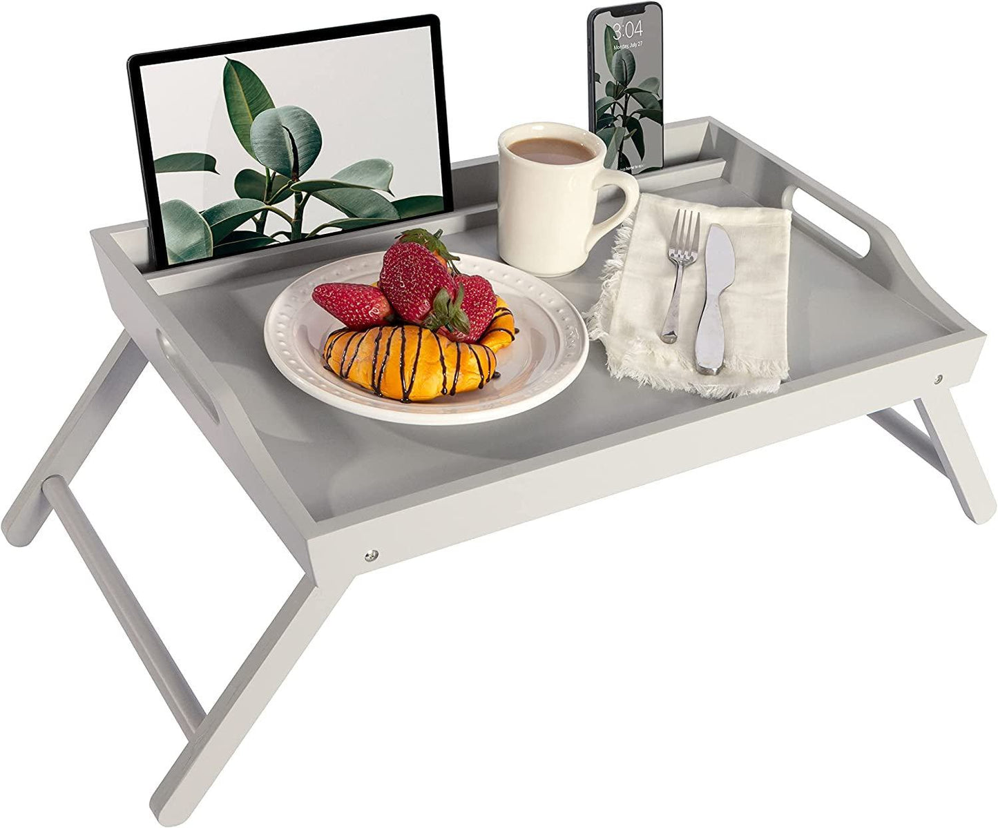 Extra large gray wood bed tray with foldable legs, built-in phone and tablet holders, holding breakfast plate, coffee, and cutlery.