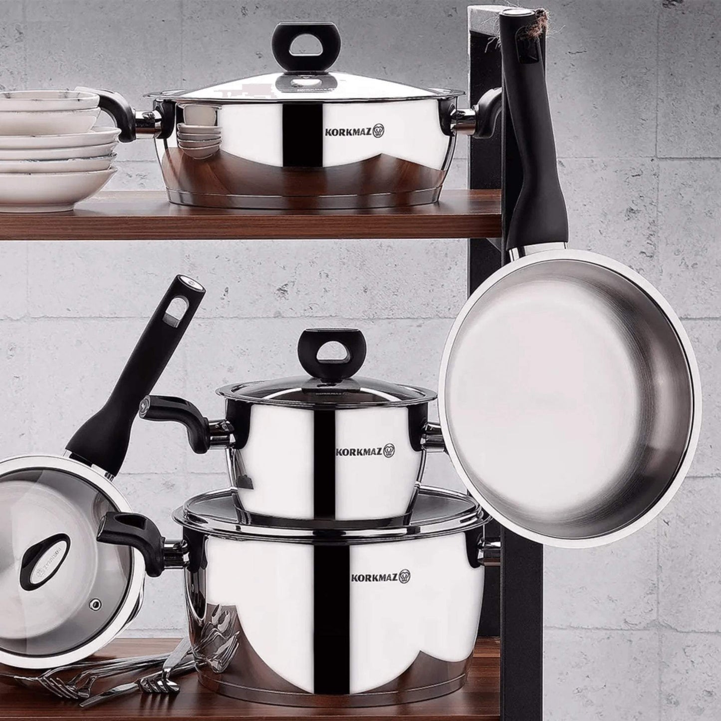 Korkmaz Nora 2L stainless steel casserole with glass lid and bakelite handles on kitchen shelf