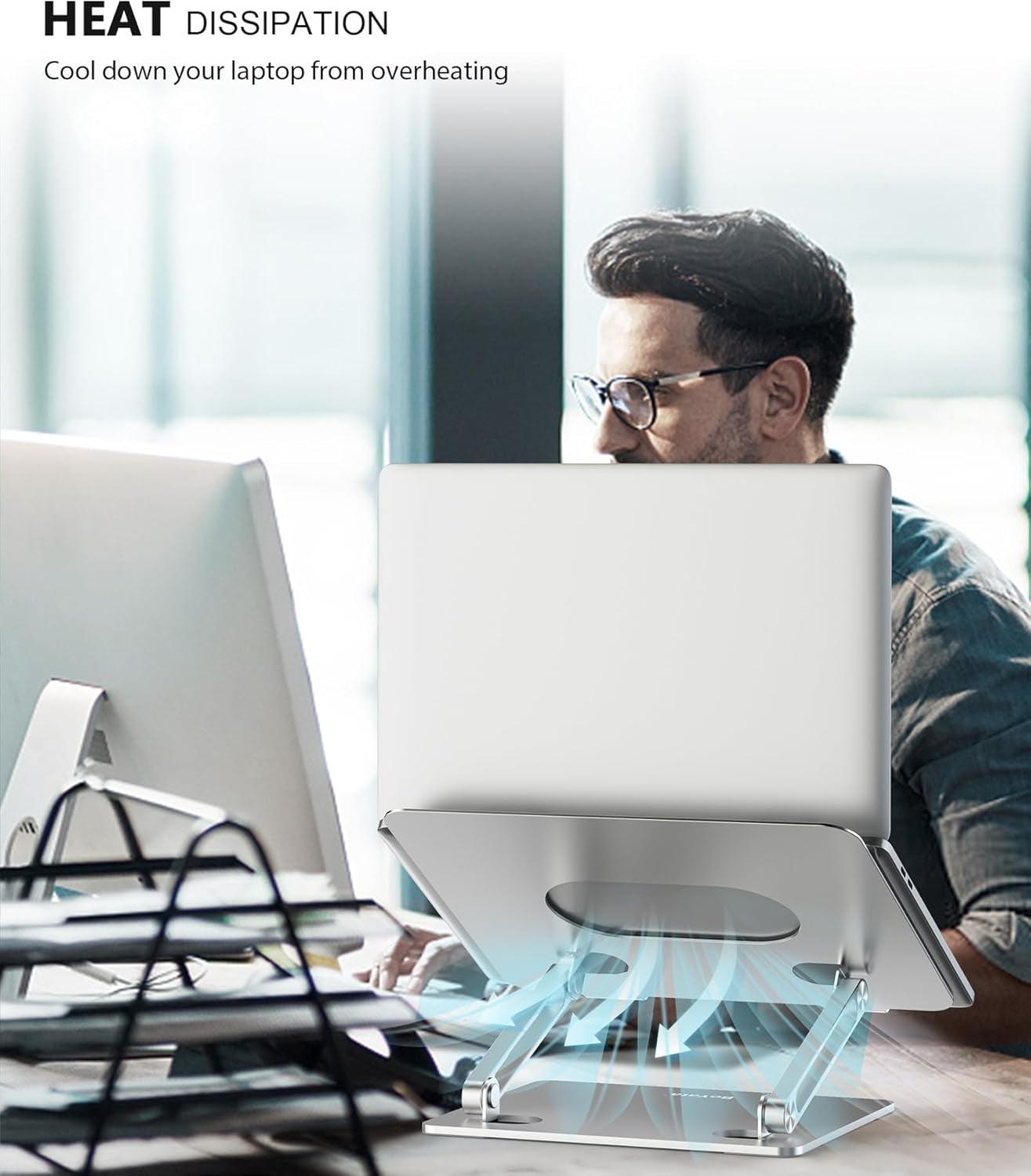 Adjustable metal laptop stand with heat ventilation and anti-slip pads supporting laptop cooling and ergonomic posture.
