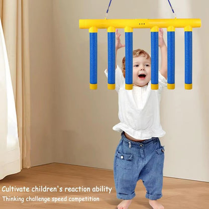 Child playing with the Challenge Falling Sticks Game to improve reaction ability and coordination skills