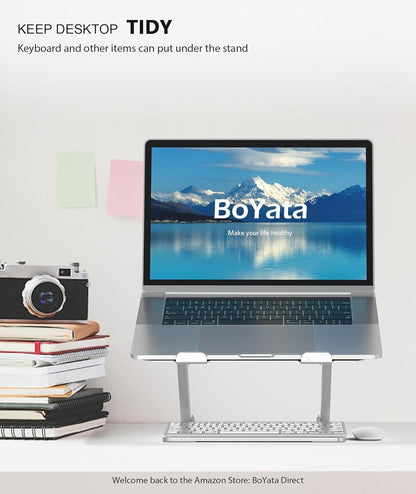 Adjustable metal laptop stand with heat ventilation and non-slip silicone pads for laptops up to 17 inches.