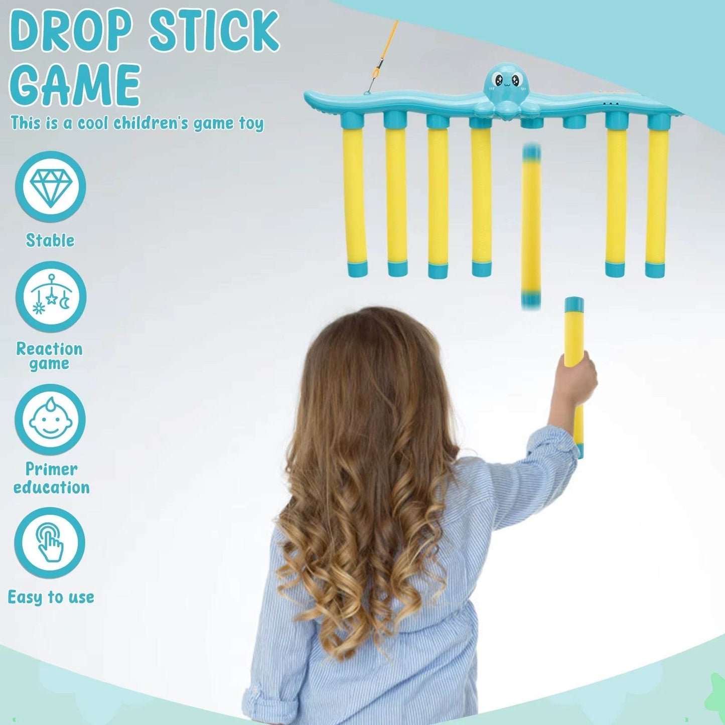 Child playing interactive falling sticks game toy to improve hand eye coordination and reaction skills